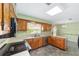 Kitchen with wooden cabinets, stainless steel appliances, and a view to the backyard at 1866 Ne 39Th Ct, Ocala, FL 34470
