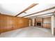 Large living room featuring a brick fireplace, wood paneling, and plenty of space at 1866 Ne 39Th Ct, Ocala, FL 34470