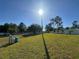 A expansive backyard with a large grassy area, offering endless possibilities for outdoor activities at 1961 Sw 170Th Loop, Ocala, FL 34473
