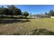 Expansive backyard with mature trees and a screened-in pool, perfect for outdoor enjoyment at 1961 Sw 170Th Loop, Ocala, FL 34473