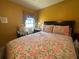 Cozy bedroom with a comfortable bed, soft floral patterned bedding, and ample natural light at 1961 Sw 170Th Loop, Ocala, FL 34473