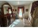 Bedroom with dark wood dresser, a chaise lounge, decorative drapery and carpeted floor at 1961 Sw 170Th Loop, Ocala, FL 34473