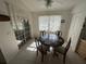 Bright breakfast nook with tile floor and lots of natural light from the glass doors and windows at 1961 Sw 170Th Loop, Ocala, FL 34473