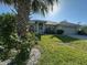 Charming single Gathering home with a lush green lawn, lovely landscaping, and a two-car garage at 1961 Sw 170Th Loop, Ocala, FL 34473