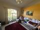 Comfortable living room with a plush sofa, recliner, and large window for ample natural light at 1961 Sw 170Th Loop, Ocala, FL 34473