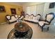 Comfortable living room features ornate furniture, a coffee table, and lots of light from the large windows at 1961 Sw 170Th Loop, Ocala, FL 34473