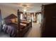 Spacious main bedroom boasts a luxurious four-poster bed, ceiling fan, and beautiful window dressings at 1961 Sw 170Th Loop, Ocala, FL 34473