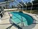 A sparkling pool inside a screened enclosure provides the perfect place to cool off on warm days at 1961 Sw 170Th Loop, Ocala, FL 34473