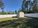 A shed in a large backyard with a full privacy fence at 1961 Sw 170Th Loop, Ocala, FL 34473