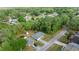 Overhead view of home, storage shed and pool surrounded by green trees in the neighborhood at 2199 Se 175Th Ter, Silver Springs, FL 34488