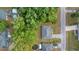 Overhead view of the home featuring a well-maintained roof, large yard, and mature trees at 2199 Se 175Th Ter, Silver Springs, FL 34488