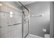 Tiled shower features clear glass doors and tile accents at 2199 Se 175Th Ter, Silver Springs, FL 34488