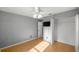 A bedroom features hardwood floors, neutral paint, a closet, and a ceiling fan at 2199 Se 175Th Ter, Silver Springs, FL 34488