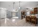 Bright kitchen featuring granite countertops, stainless steel appliances, breakfast bar, and open layout at 2199 Se 175Th Ter, Silver Springs, FL 34488