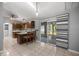 Modern kitchen with granite countertops, wood cabinets, island with seating, and stainless steel appliances at 2199 Se 175Th Ter, Silver Springs, FL 34488