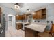 Kitchen showcasing granite countertops, dark wood cabinets, stainless steel appliances, and tile flooring at 2199 Se 175Th Ter, Silver Springs, FL 34488