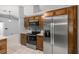 Modern kitchen showcasing stainless steel appliances, dark wood cabinets and bright, neutral paint at 2199 Se 175Th Ter, Silver Springs, FL 34488
