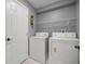 A laundry room features a full-sized washer and dryer at 2199 Se 175Th Ter, Silver Springs, FL 34488