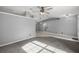 Spacious living room featuring carpet flooring, neutral paint, ceiling fan, and recessed lighting at 2199 Se 175Th Ter, Silver Springs, FL 34488