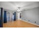 Spacious main bedroom with hardwood floors, sliding glass doors to patio, and ceiling fan at 2199 Se 175Th Ter, Silver Springs, FL 34488