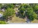 Aerial shot of the house, shed, and outbuilding surrounded by trees at 2300 Ne 49Th St, Ocala, FL 34479
