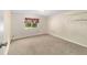 A bedroom with carpet, a window, and a ceiling light at 2300 Ne 49Th St, Ocala, FL 34479