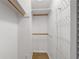 Walk-in closet with ample storage shelves, rods and carpeted floor at 2300 Ne 49Th St, Ocala, FL 34479