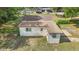 View of the home's back exterior and yard at 2300 Ne 49Th St, Ocala, FL 34479