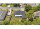 Home's backyard features a screened-in patio and a well maintained lawn surrounded by mature trees at 3011 Se 46Th Ave, Ocala, FL 34480