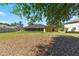 Large backyard with lots of grass, a screened patio, and an appealing home at 3011 Se 46Th Ave, Ocala, FL 34480