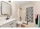 Bathroom featuring modern sink vanity, toilet, shower, and tub with a curtain at 3011 Se 46Th Ave, Ocala, FL 34480