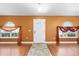 Welcoming foyer with stone tile and decorative curtains at 3011 Se 46Th Ave, Ocala, FL 34480