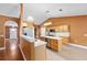 Open kitchen featuring stainless appliances, white marble countertops, and bright cabinets at 3011 Se 46Th Ave, Ocala, FL 34480