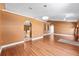 Spacious living room with hardwood floors, arched doorways, and recessed lighting at 3011 Se 46Th Ave, Ocala, FL 34480
