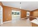 Bright living area with sliding glass doors to lanai and a neutral color palette at 3011 Se 46Th Ave, Ocala, FL 34480