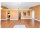 Open living room with hardwood floors and arched doorways at 3011 Se 46Th Ave, Ocala, FL 34480
