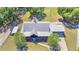 Aerial view of metal roof and lush green yard of residential property at 3360 Se 183Rd Avenue Rd, Ocklawaha, FL 32179