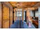 Rustic-style bathroom featuring wood paneled walls, vanity, and a custom-built sauna at 3360 Se 183Rd Avenue Rd, Ocklawaha, FL 32179