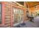 Rustic log cabin featuring a prominent wooden front door with Western decor at 3360 Se 183Rd Avenue Rd, Ocklawaha, FL 32179