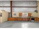 Barn kitchen area featuring custom cabinetry, window and black appliances at 3360 Se 183Rd Avenue Rd, Ocklawaha, FL 32179