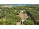 Aerial view of a vast parcel of land in a tree-filled area near a lake at 3360 Se 183Rd Avenue Rd, Ocklawaha, FL 32179
