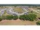 An aerial shot shows a residential area, with well-kept lawns, and landscaping at 4306 Nw 54Th Ter, Ocala, FL 34482