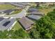 An aerial view of a backyard showcasing the lawn, trees, and outdoor living space at 4306 Nw 54Th Ter, Ocala, FL 34482