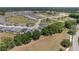 Aerial view shows houses situated within a community featuring landscaping and green spaces at 4306 Nw 54Th Ter, Ocala, FL 34482
