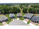 Aerial shot of homes in a community near green spaces and a lake at 4306 Nw 54Th Ter, Ocala, FL 34482