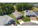 Elevated view showcasing houses near greenery and a golf course in the distance at 4306 Nw 54Th Ter, Ocala, FL 34482