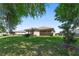 Serene backyard featuring lush greenery and a view of the home's exterior at 4306 Nw 54Th Ter, Ocala, FL 34482