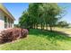 Expansive backyard featuring lush green grass and mature trees in a serene setting at 4306 Nw 54Th Ter, Ocala, FL 34482