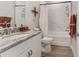 Bathroom with vanity, marble-look tile, and shower-tub combo at 4306 Nw 54Th Ter, Ocala, FL 34482