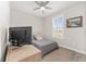Bedroom featuring a window with plantation shutters, area rug, and dresser at 4306 Nw 54Th Ter, Ocala, FL 34482